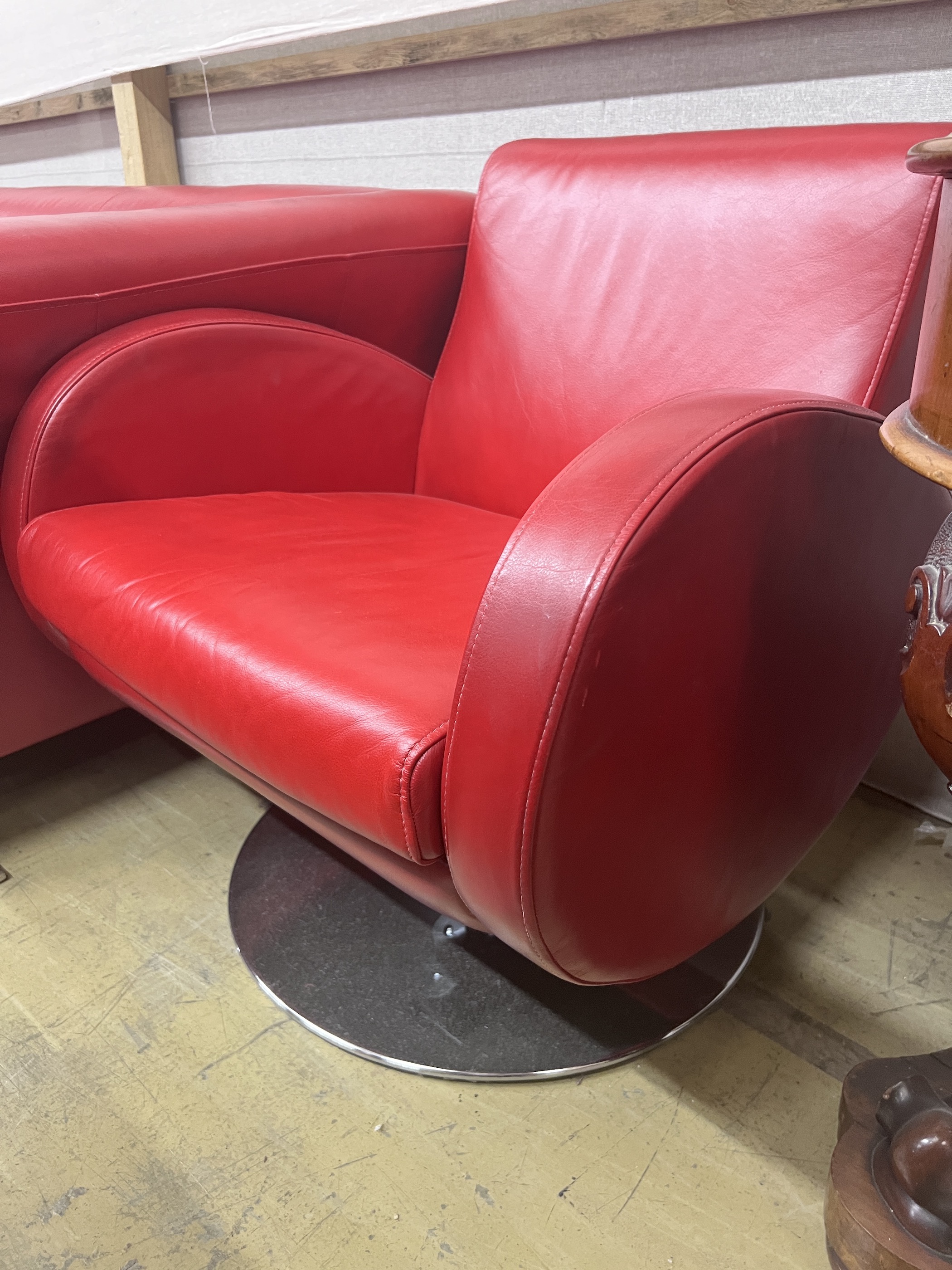 A contemporary leather three seater settee, length 204cm, width 86cm, height 70cm and two similar swivel armchairs on chrome bases